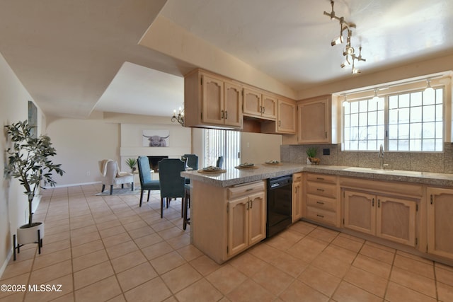 kitchen featuring light brown cabinetry, black dishwasher, sink, decorative backsplash, and light tile patterned floors