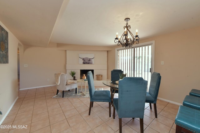 dining room featuring light tile patterned floors and an inviting chandelier