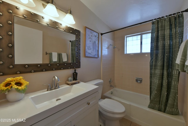 full bathroom with shower / tub combo with curtain, vanity, and toilet