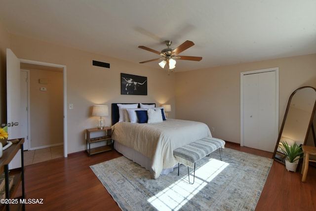 bedroom featuring dark wood-type flooring and ceiling fan