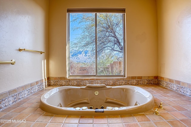 bathroom with tiled bath