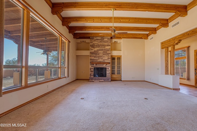 unfurnished living room with a healthy amount of sunlight, a fireplace, and ceiling fan