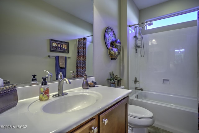 full bathroom featuring shower / bath combination with curtain, vanity, and toilet