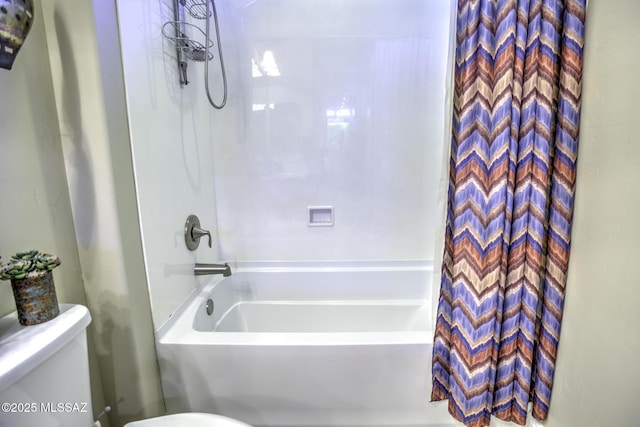 bathroom with shower / bath combo with shower curtain