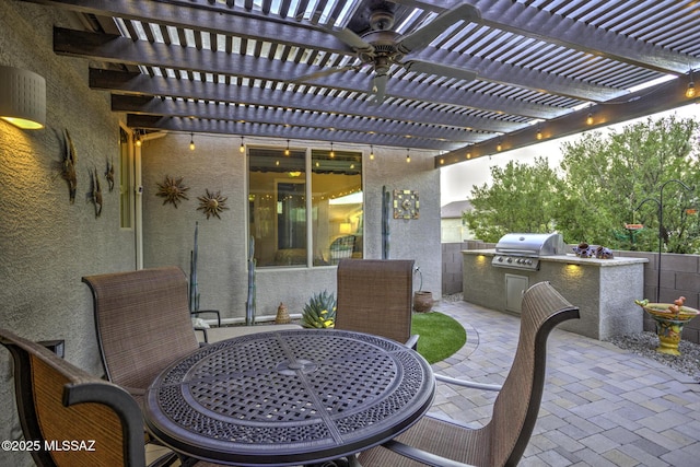 view of patio / terrace with area for grilling, grilling area, and a pergola