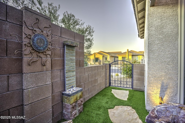 view of gate at dusk