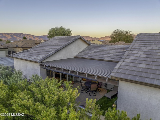 10221 S Rose Wagon Way, Vail, AZ 85641 - details with a mountain view and stucco siding