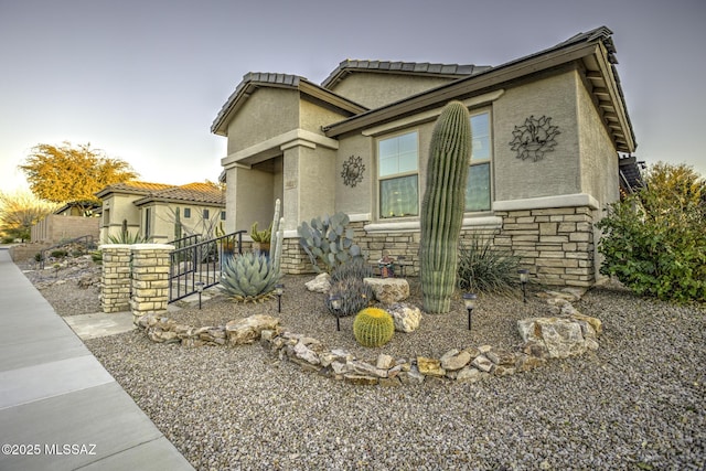 10221 S Rose Wagon Way, Vail, AZ 85641 - view of front of property featuring fence, stucco siding, and stone siding