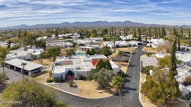 birds eye view of property featuring a mountain view