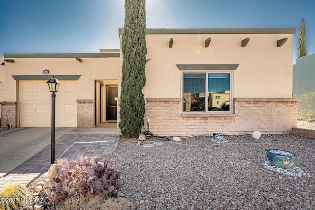 southwest-style home featuring a garage