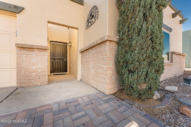 entrance to property with a patio area