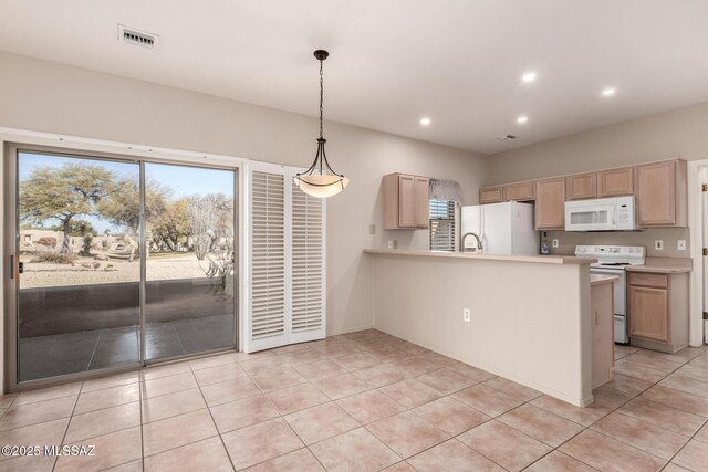 kitchen featuring pendant lighting, white appliances, light tile patterned flooring, light brown cabinetry, and kitchen peninsula