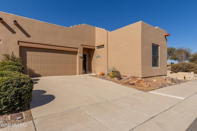 southwest-style home featuring a garage