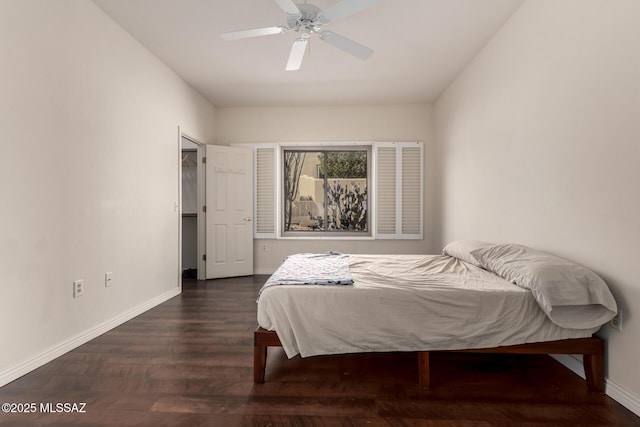 bedroom with dark wood-type flooring and ceiling fan