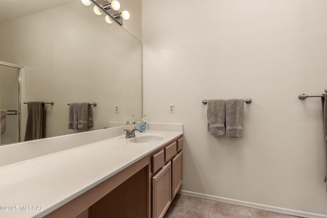 bathroom with vanity and tile patterned flooring