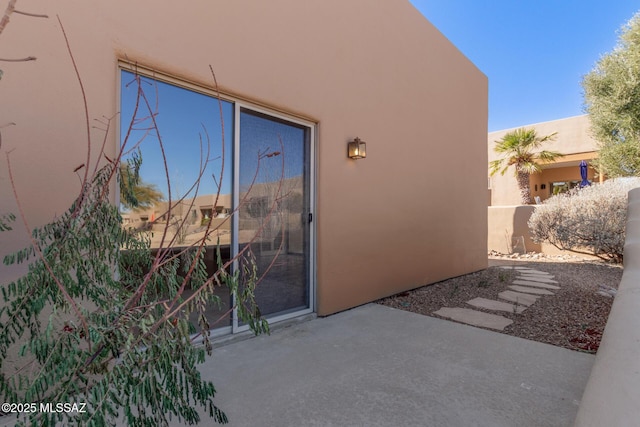 doorway to property featuring a patio area