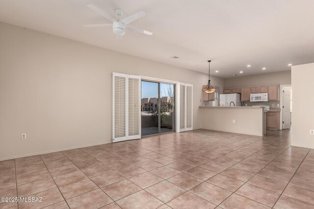 interior space featuring light tile patterned floors and ceiling fan