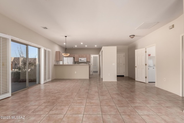 unfurnished living room with light tile patterned flooring