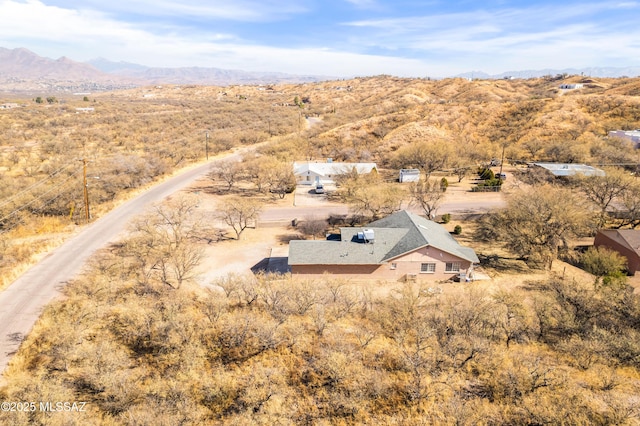 drone / aerial view featuring a mountain view