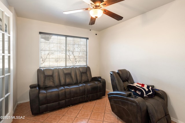 tiled living room with ceiling fan