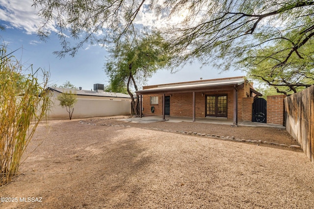 back of property featuring a patio area