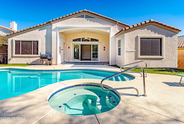 view of pool featuring an in ground hot tub, area for grilling, and a patio area