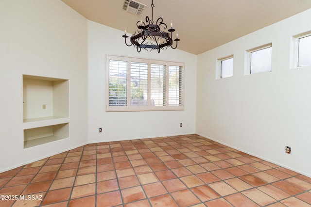 unfurnished dining area with built in shelves, vaulted ceiling, a chandelier, and tile patterned flooring