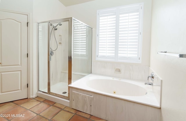 bathroom with tile patterned floors and independent shower and bath