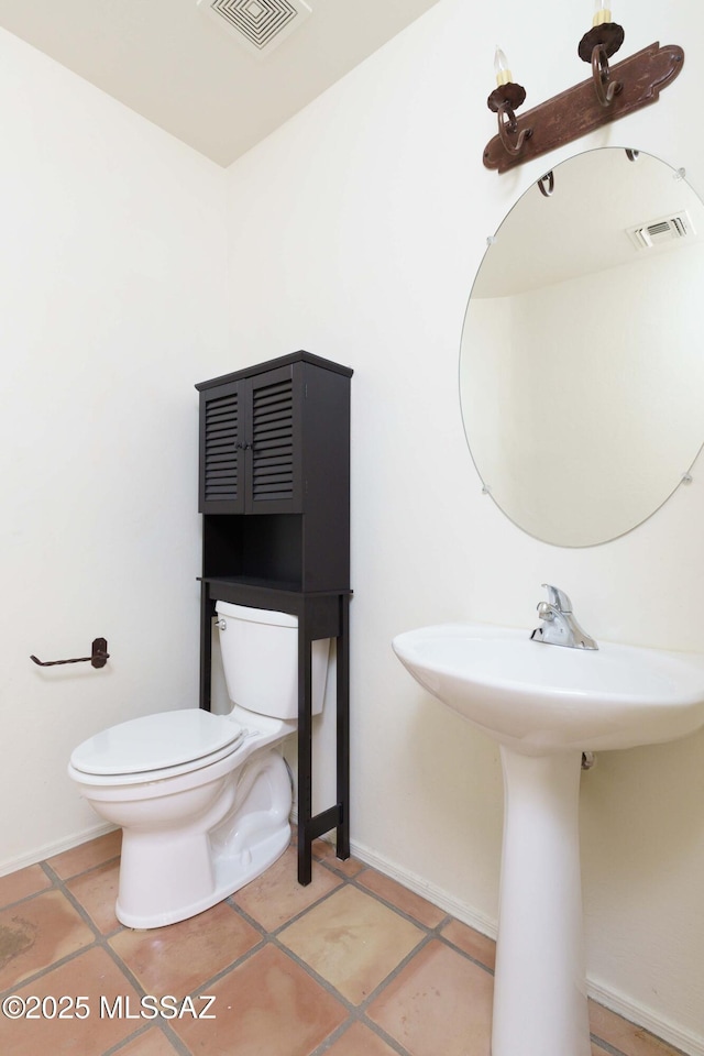 bathroom with sink, tile patterned floors, and toilet