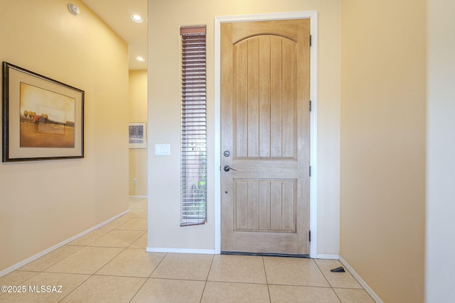 foyer entrance featuring light tile patterned floors