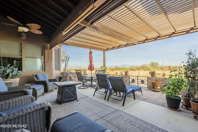 view of patio / terrace with a mountain view, an outdoor hangout area, and a pergola