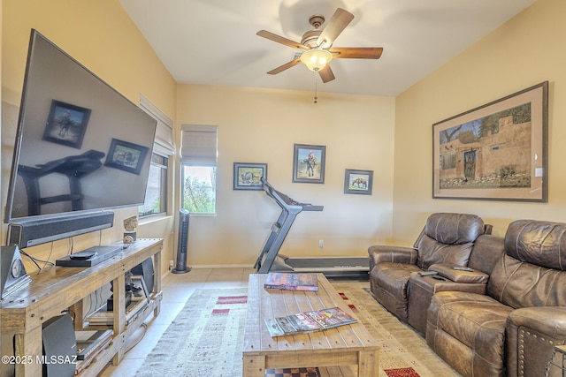 workout room with light tile patterned flooring and ceiling fan