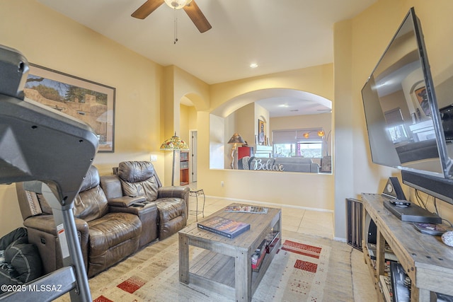 tiled living room featuring ceiling fan