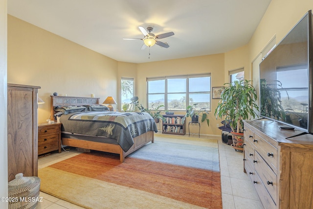 tiled bedroom with ceiling fan