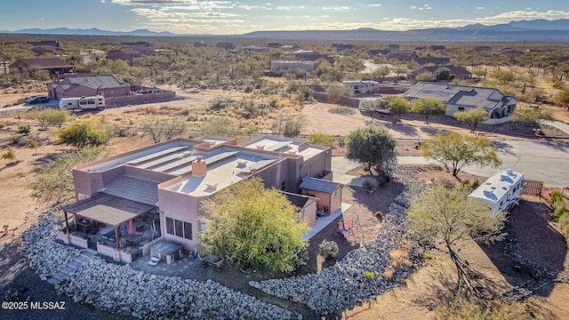 drone / aerial view featuring a mountain view