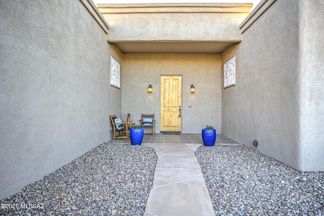 entrance to property featuring a patio