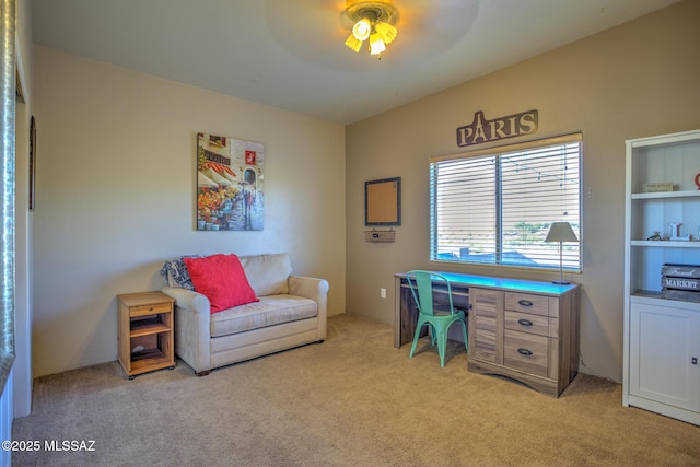 office space with vaulted ceiling, light colored carpet, and ceiling fan