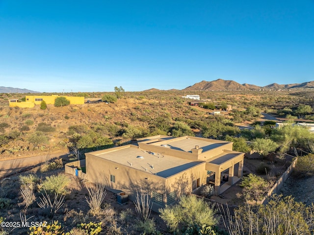 birds eye view of property featuring a mountain view