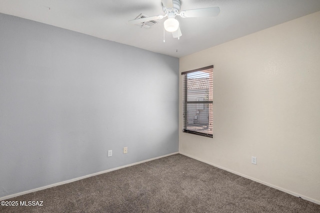 carpeted spare room featuring ceiling fan