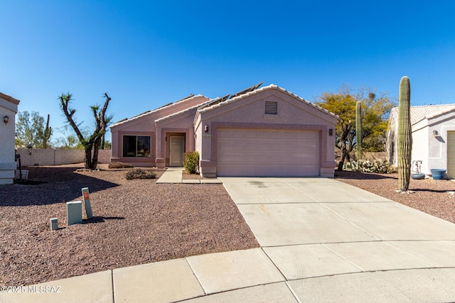 ranch-style house featuring a garage