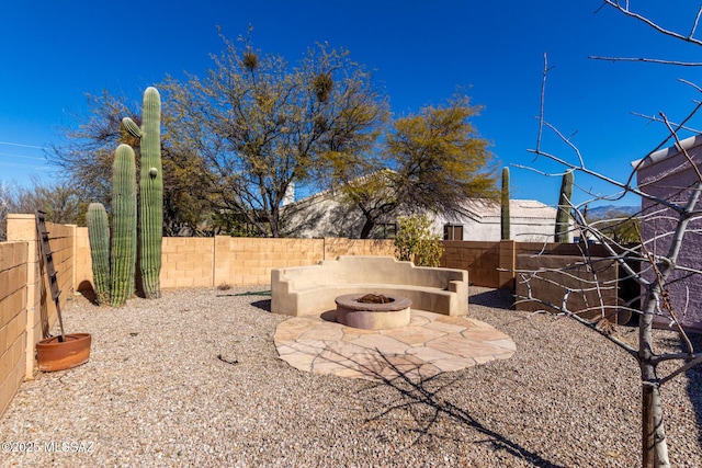 view of yard featuring a patio area and an outdoor fire pit