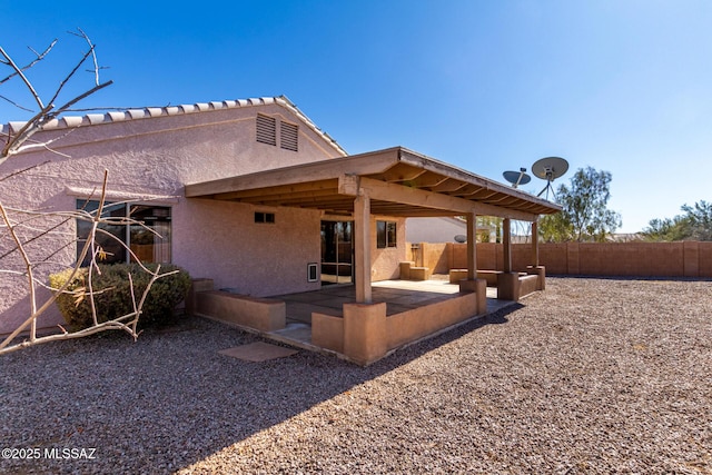back of property featuring a patio