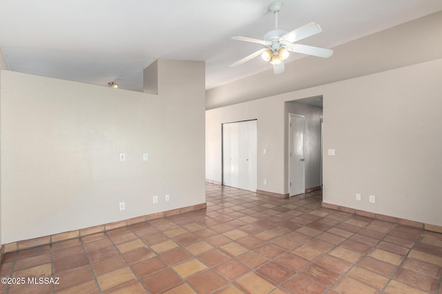 unfurnished room featuring tile patterned floors and ceiling fan