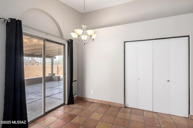unfurnished dining area featuring an inviting chandelier