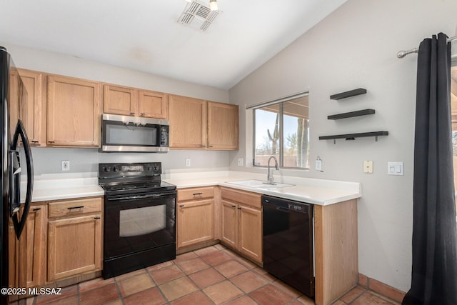 kitchen featuring lofted ceiling, tile patterned flooring, sink, and black appliances