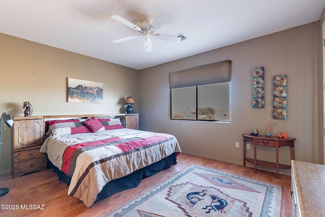 bedroom featuring hardwood / wood-style floors and ceiling fan