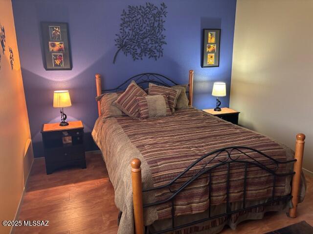 bedroom featuring hardwood / wood-style flooring