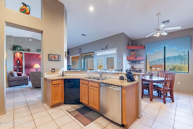 kitchen with kitchen peninsula, sink, dishwasher, and light tile patterned floors