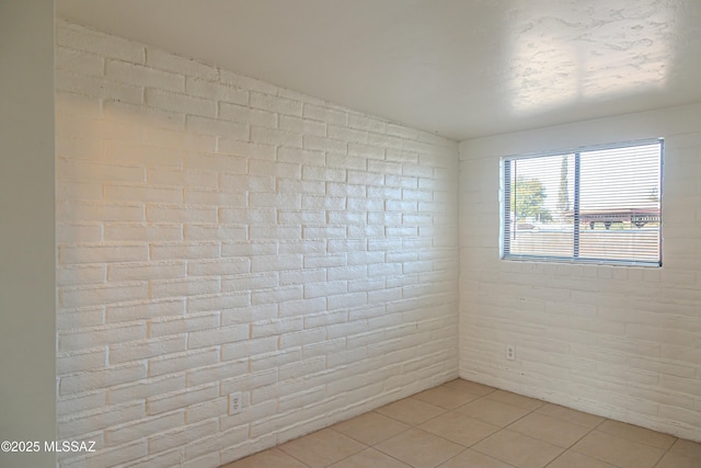 unfurnished room with light tile patterned floors