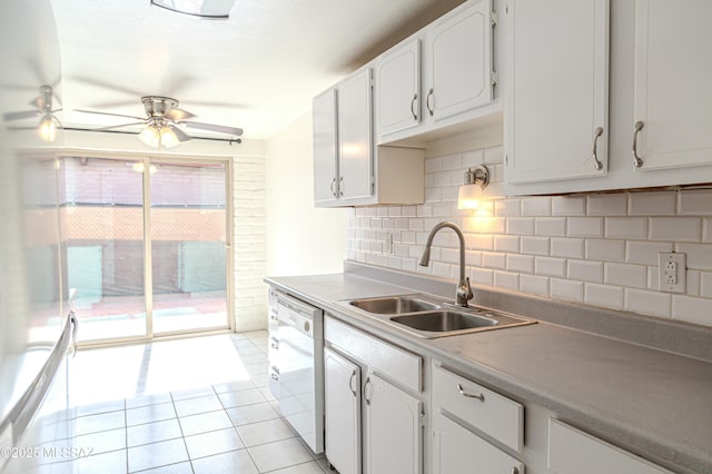 kitchen with white cabinetry, white dishwasher, sink, and decorative backsplash